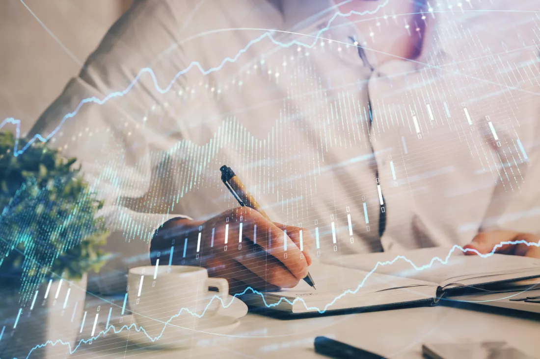 double-exposure-man-s-hands-writing-notes-stock-market-with-forex-chart