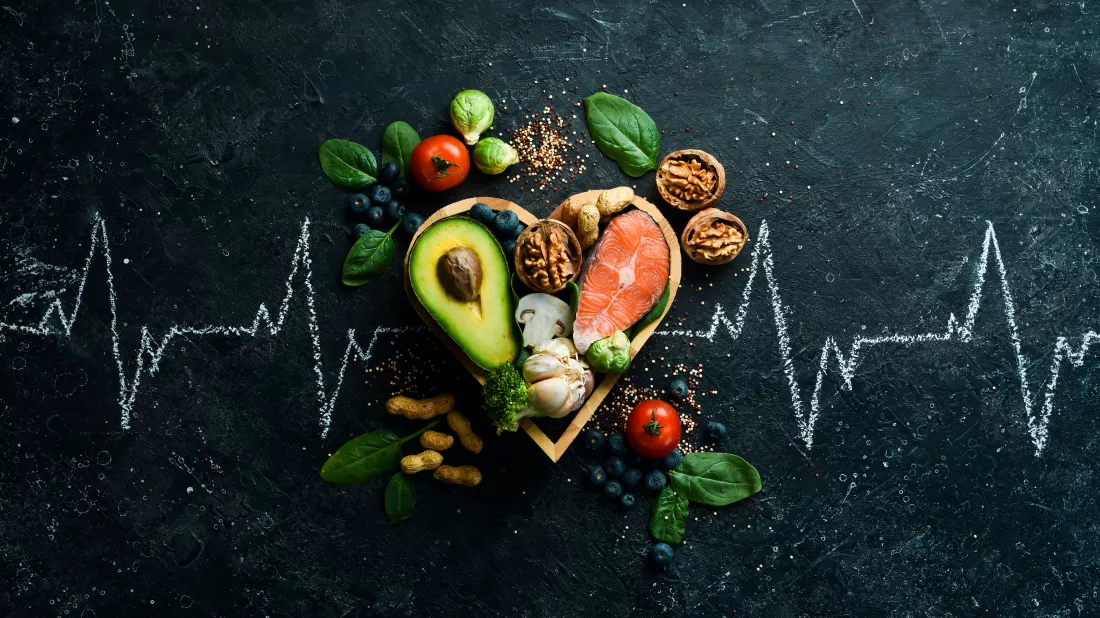 food-banner-healthy-foods-low-carbohydrates-food-heart-health-salmon-avocados-blueberries-broccoli-nuts-mushrooms-black-stone-background-top-view